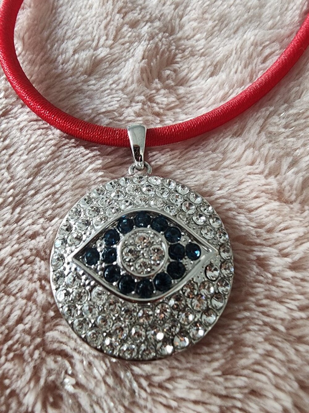 JOAN BOYCE CRYSTAL EVIL EYE PENDANT ON RED CORD